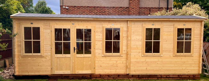 Image of a Dunster House Log Cabin, now installed by Kent Cabin Craft Centre