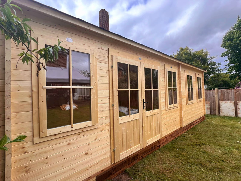 Image of a Dunster House Log Cabin, now installed by Kent Cabin Craft Centre